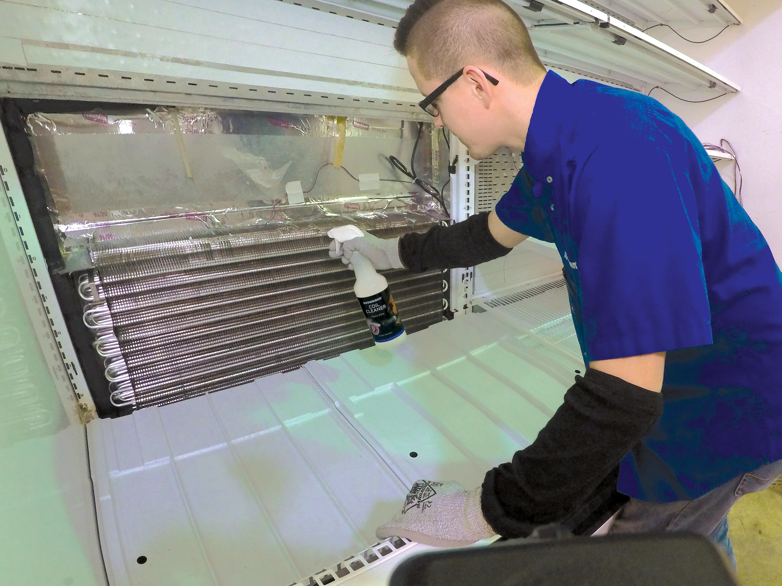 Technician Using Coil Cleaner